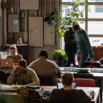 People working at computers in a coworking space