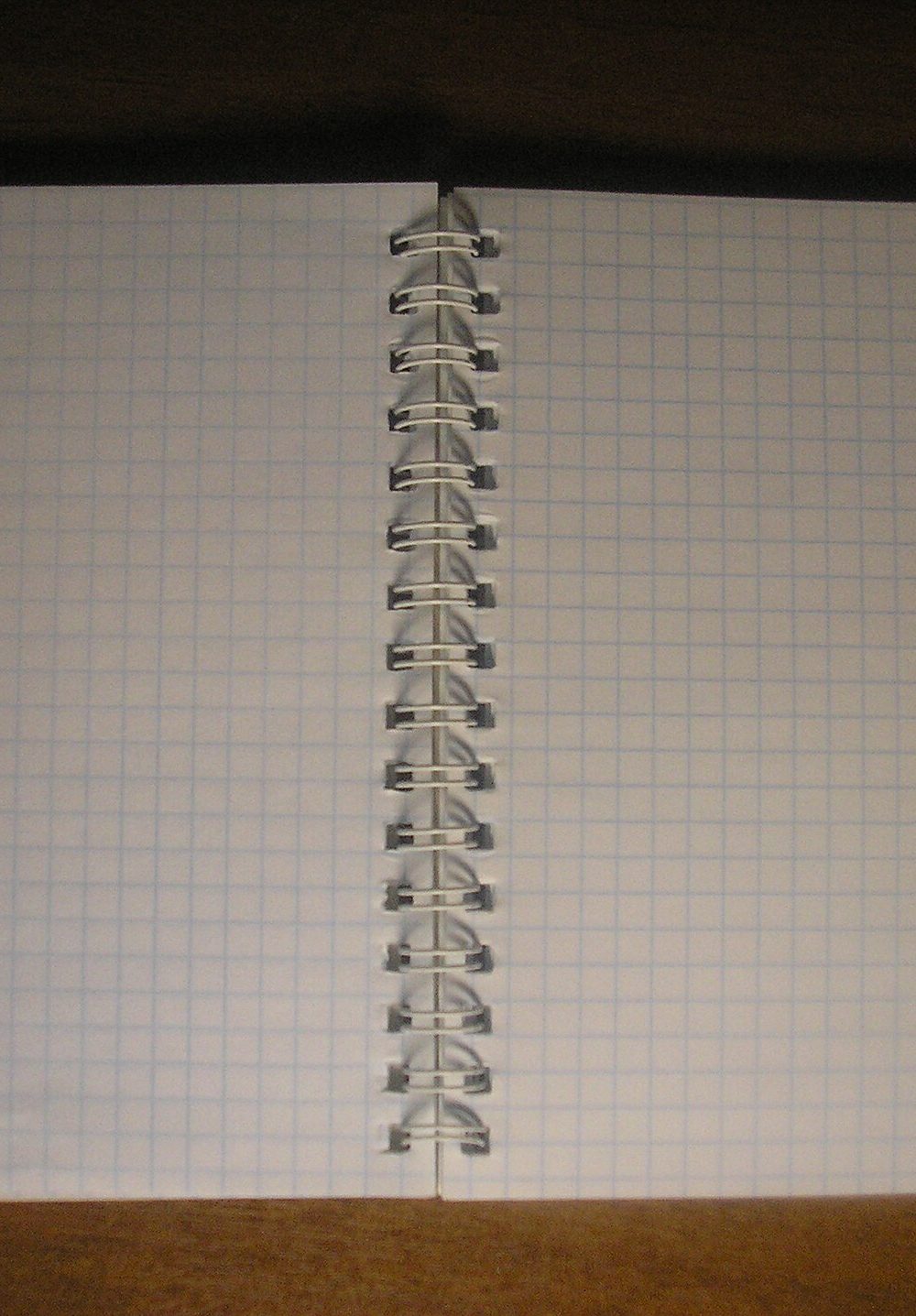 An open notepad with blank pages